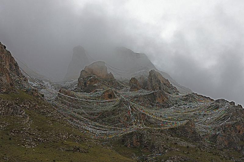 055 Prayer flags adorn hillside near Ganden Monastery.jpg